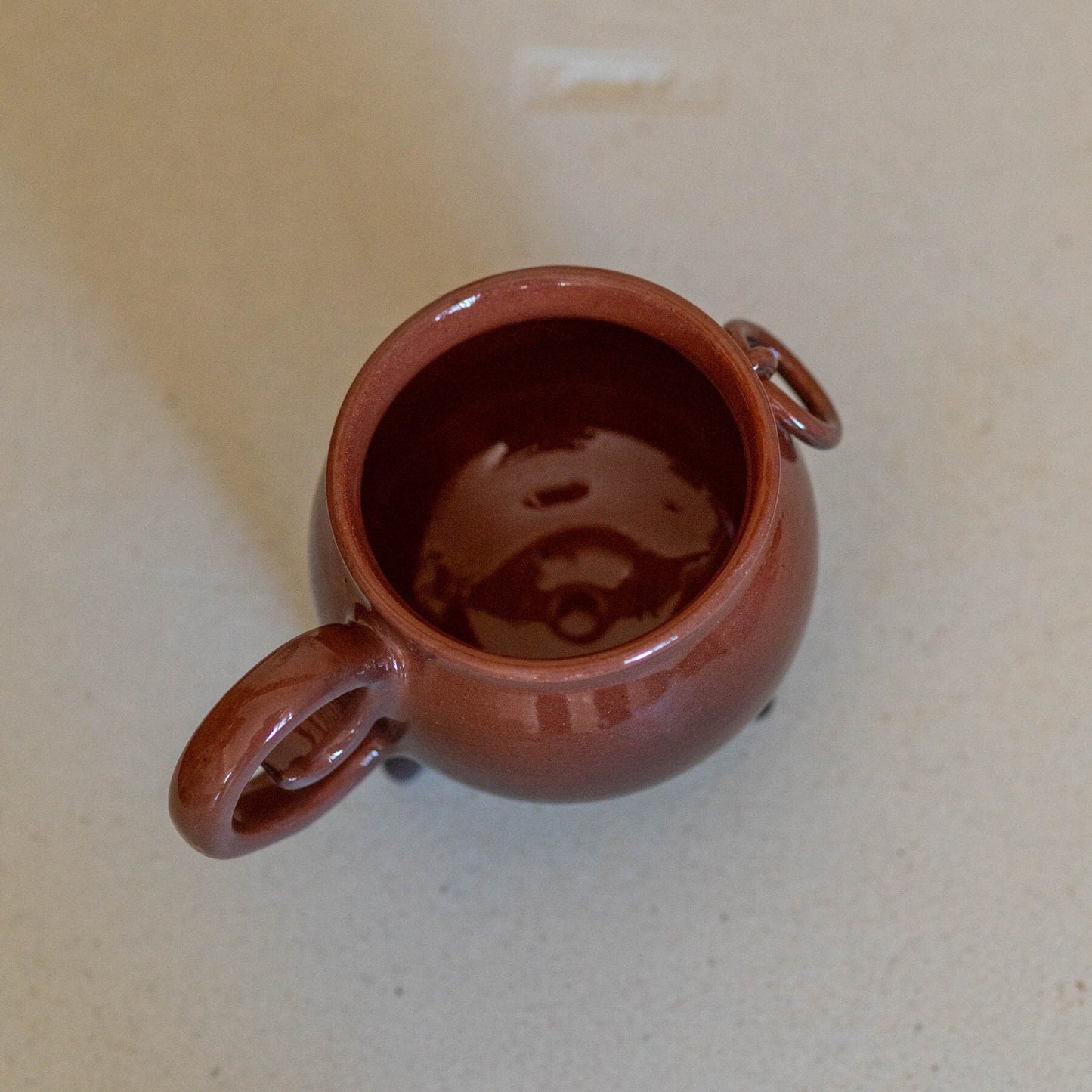 Unique Halloween cauldron mug, handcrafted from ceramic. Perfect for adding a touch of spooky charm to your morning coffee or evening tea. This pottery mug is a great addition to Halloween decor and makes a thoughtful gift for Halloween lovers.