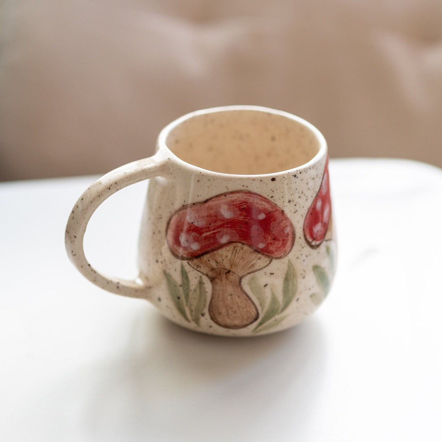 Charming mushroom mug, handmade from high-quality ceramic. This large coffee mug is perfect for enjoying hot drinks and is an excellent gift for nature lovers. Its whimsical design adds a touch of personality to any kitchen.