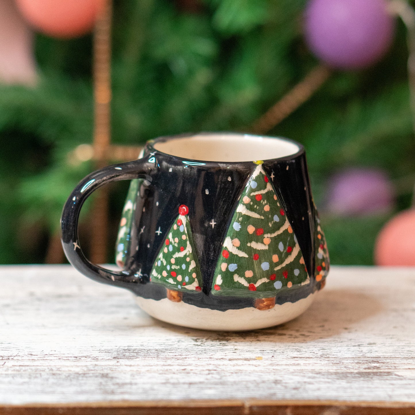 The New Year Tree Christmas Coffee Mug set against a festive backdrop, illustrating its potential as a perfect Christmas gift.