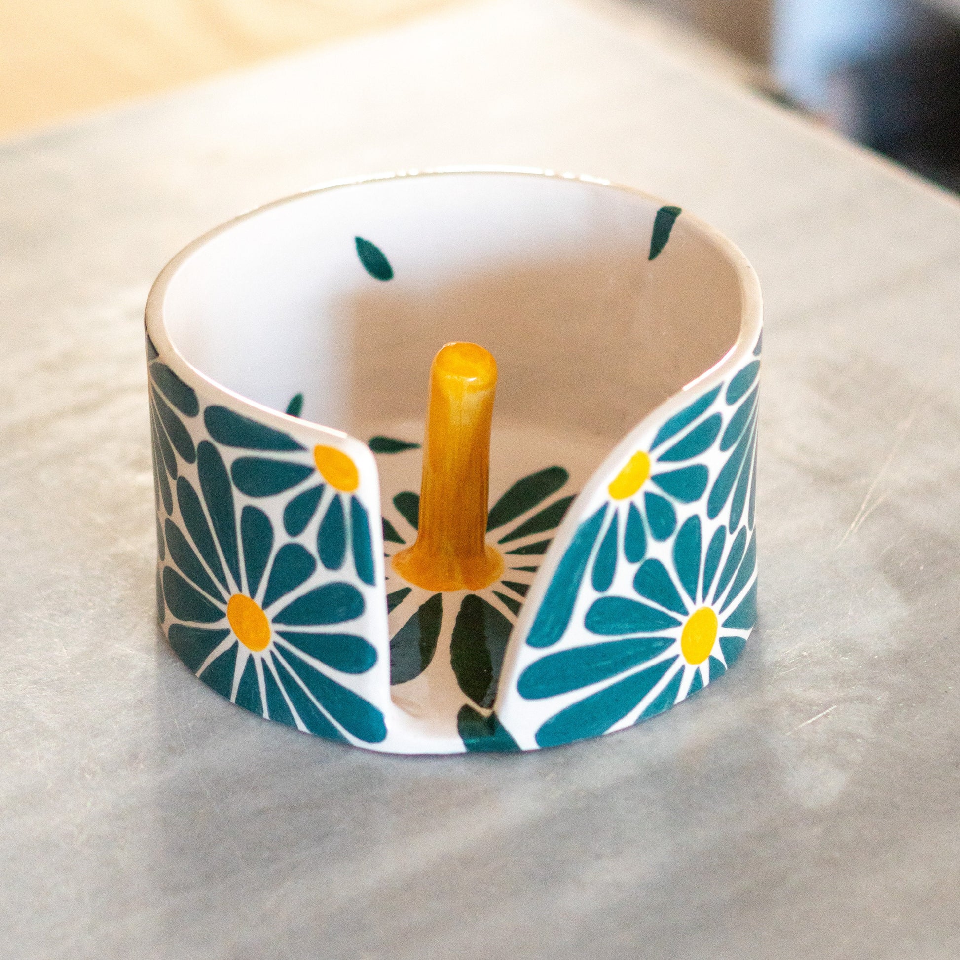 Artistic representation of the paper towel holder as an ideal housewarming or unique holiday gift option