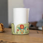 Handmade ceramic napkin holder with a beautiful floral design, perfect for adding a touch of elegance to your kitchen decor. This green ceramic paper towel holder is both functional and stylish, making it an ideal unique gift idea for any occasion.